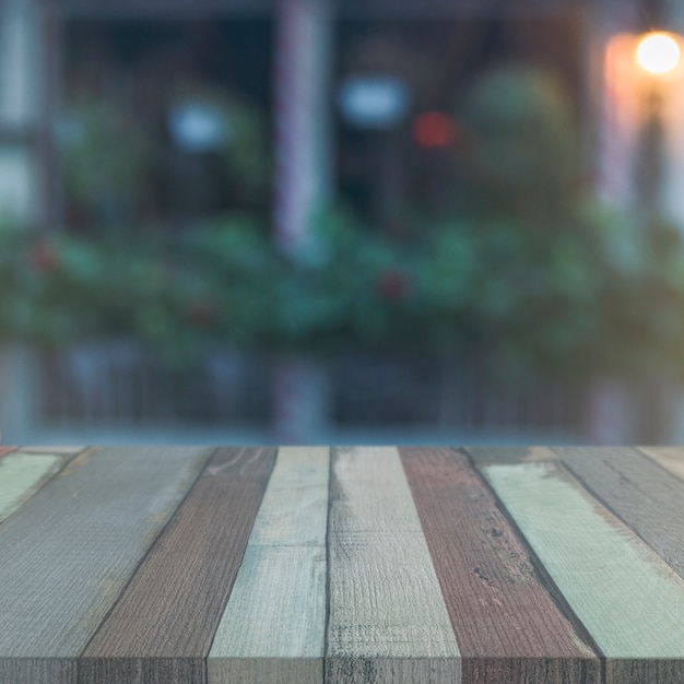 Wooden surface in front of abstract blurred background