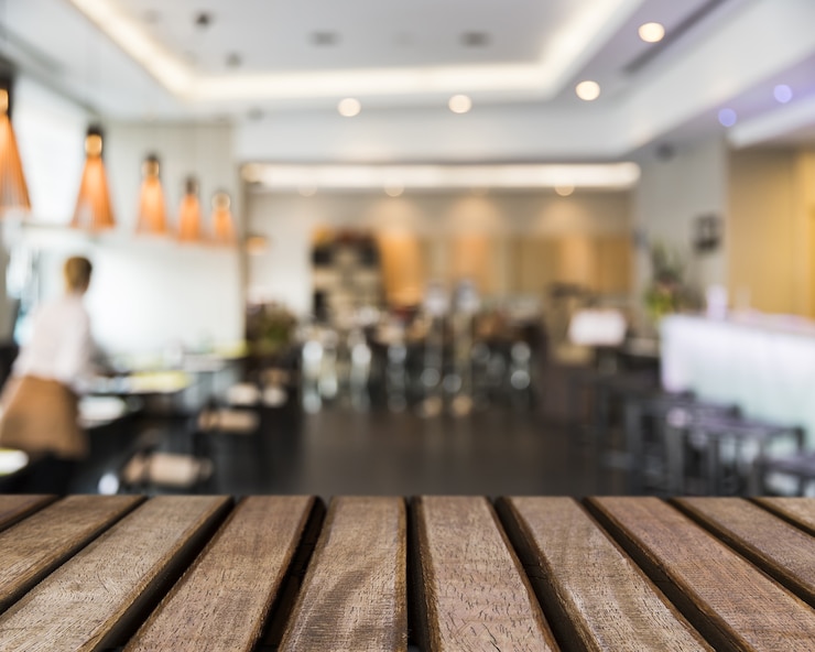 Free Photo wooden surface looking out to restaurant scene