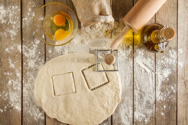 Wooden surface with dough and other elements