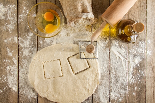 Wooden surface with dough and other elements