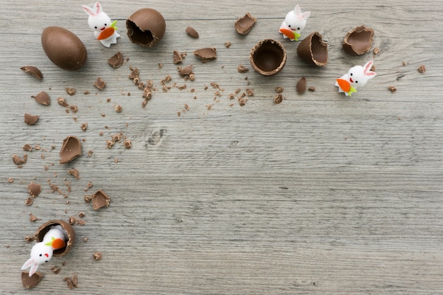Wooden surface with easter eggs and rabbits
