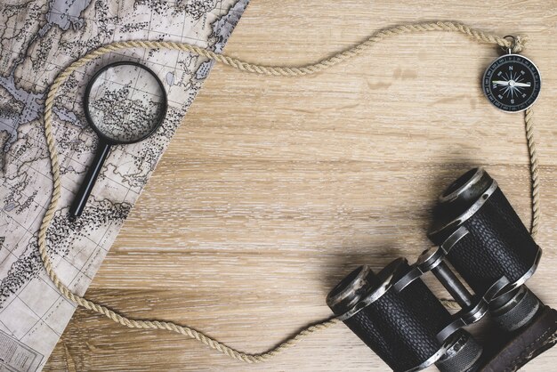 Wooden surface with map and other travel elements