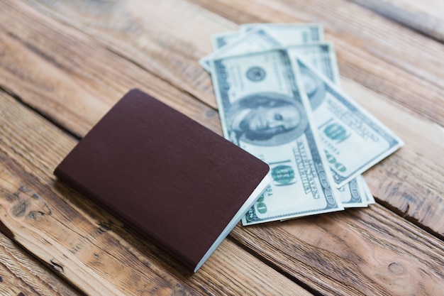 Wooden surface with passport and bills