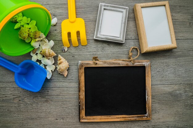 Wooden surface with summer elements, slate and frames