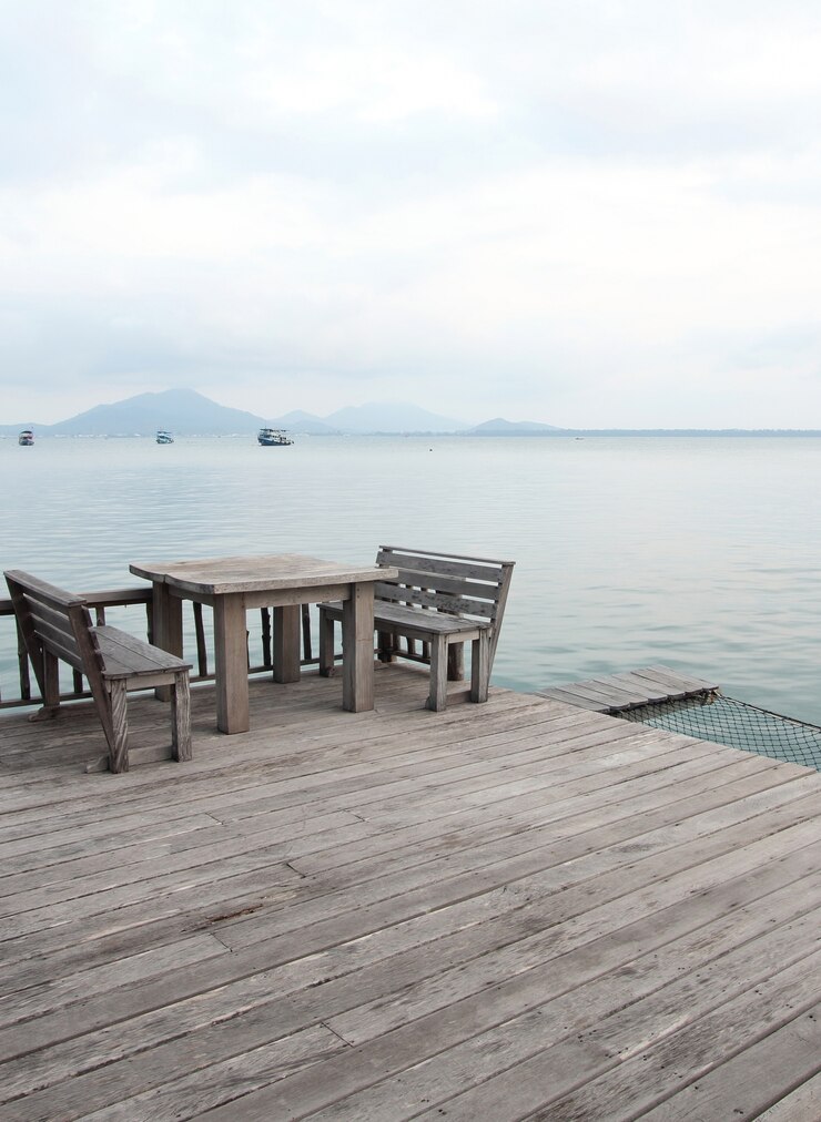 Free Photo wooden table and chairs on a tropical beach resort