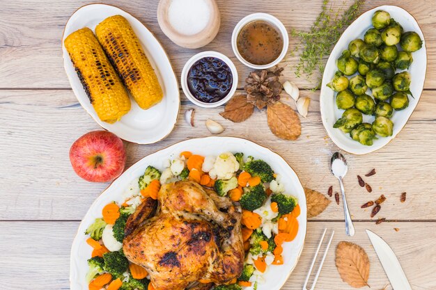 Wooden table covered with various food