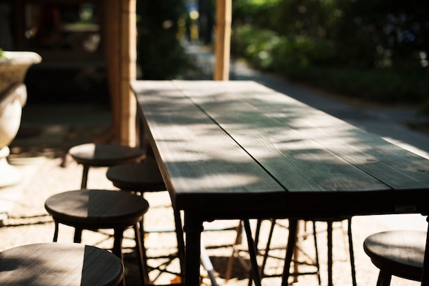 Free photo wooden table of the outdoors cafe