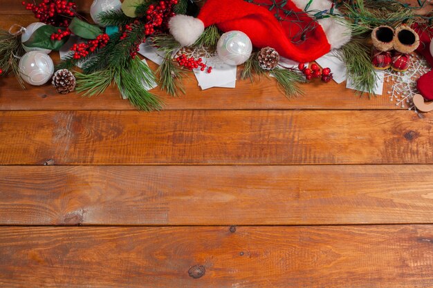 The wooden table with Christmas decorations with copy space for text. Christmas mockup concept