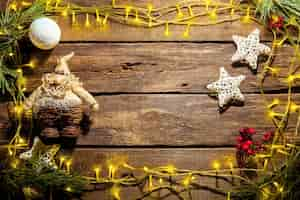 Free photo the wooden table with christmas decorations