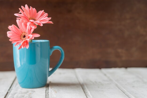 Wooden table with decorative mug