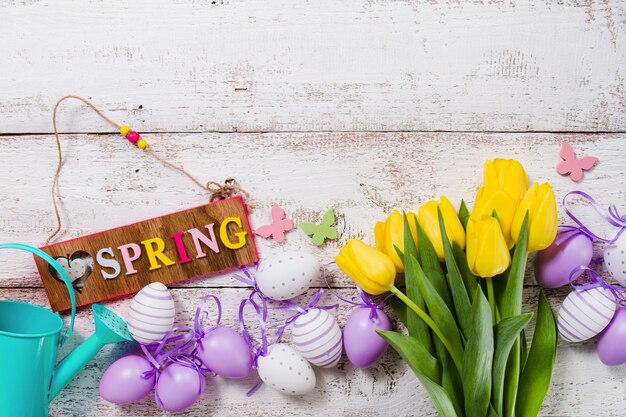 Wooden table with decorative spring objects