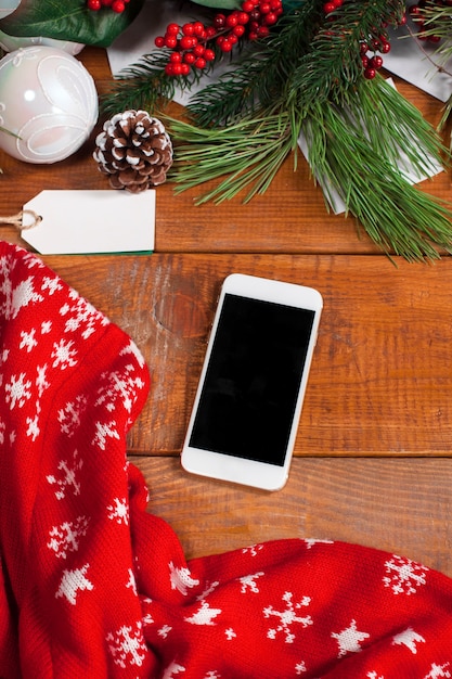 Free photo the wooden table with a smartphone, top view