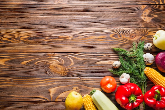 Wooden table with vegetables on right