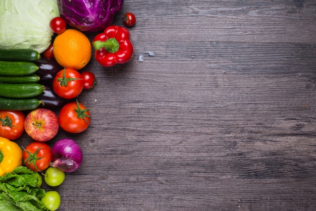 Wooden table with vegetables