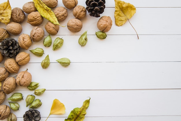 Wooden table with walnuts