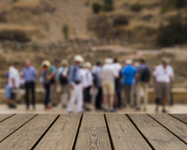 Wooden texture looking out to group of people