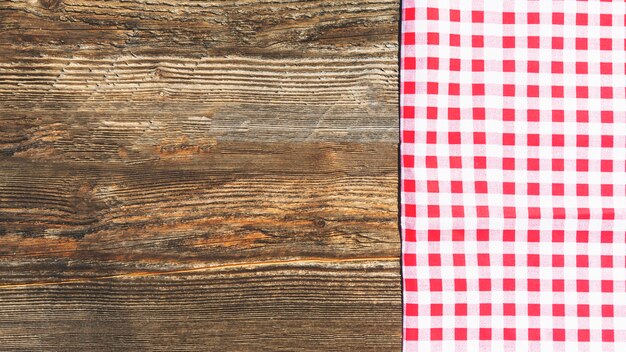 Wooden textured plank and checkered table cloth