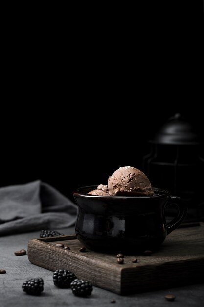 Wooden tray with bowl with ice cream