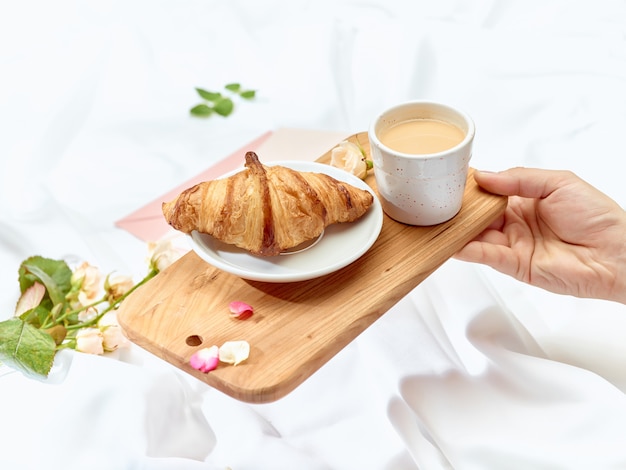 Wooden tray with breakfast