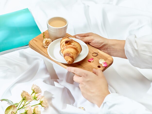 Wooden tray with breakfast