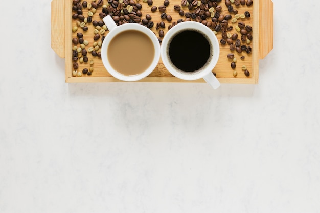 Wooden tray with coffee and copy space