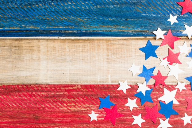 Free Photo wooden usa flag with red; blue and white paper cutout stars
