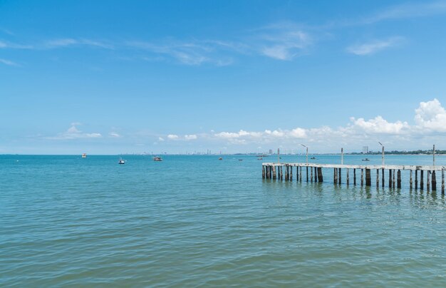 Wooden walking way on the beach leading to the sea