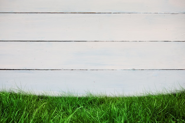 Wooden wall with grass