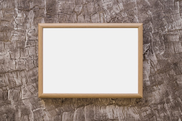 Wooden whiteboard on design wallpaper