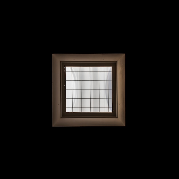 Wooden window frame on black background