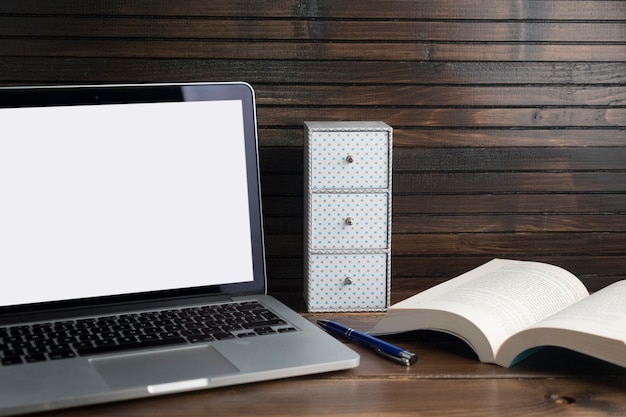 Free photo wooden workspace still life with laptop