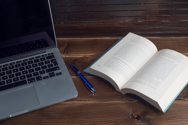 Free photo wooden workspace still life with laptop