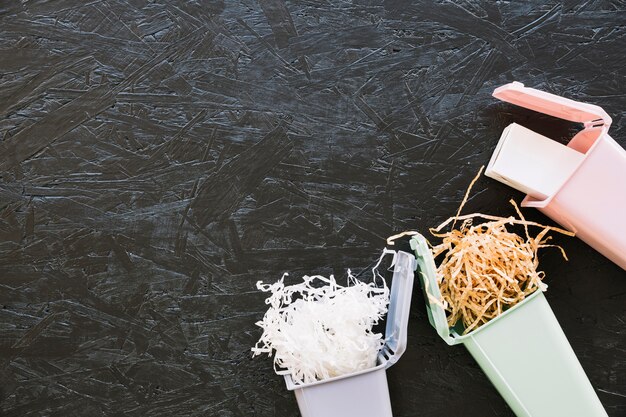 woodshave and bottle in miniature dustbin