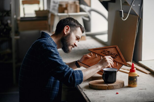 Woodworker applying glue to coards