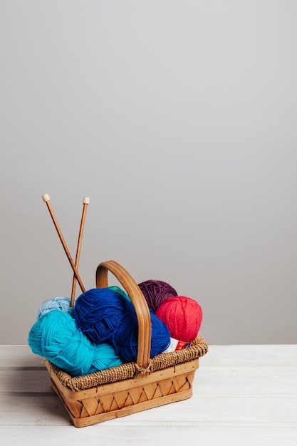 Wool balls in different colors in basket