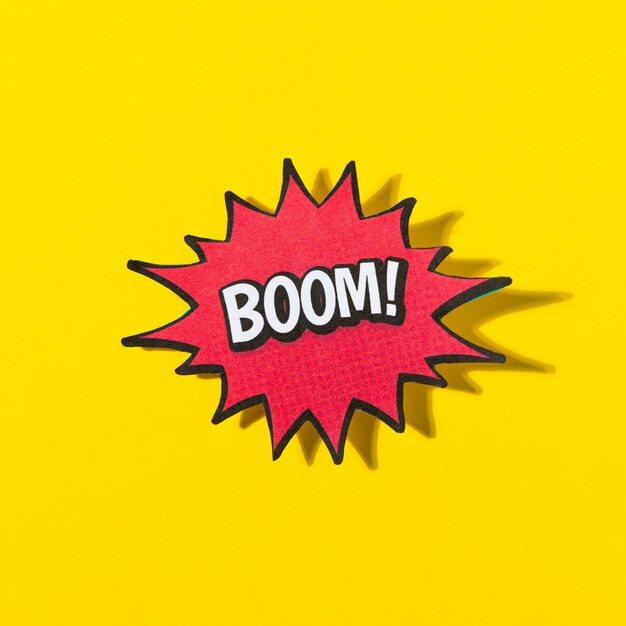 Word boom! in retro comic speech bubble on yellow background