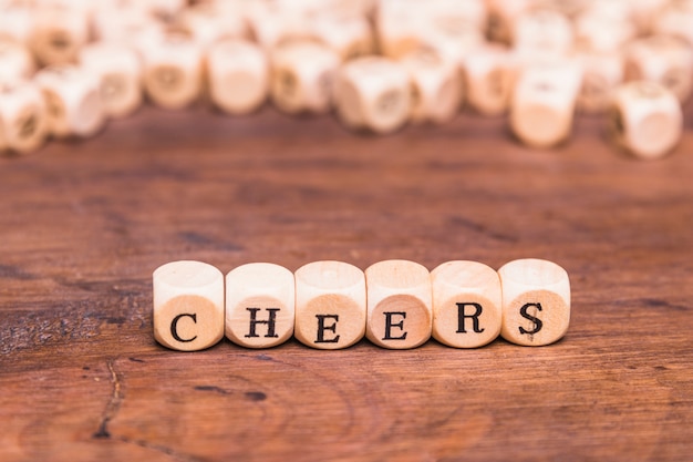 The word cheers written on wooden block shape