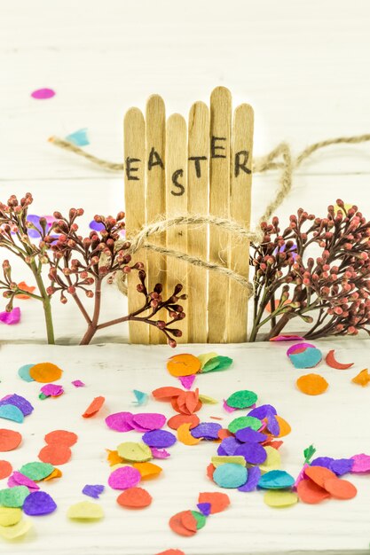 Free photo the word easter in the conceptual block text on wooden sticks