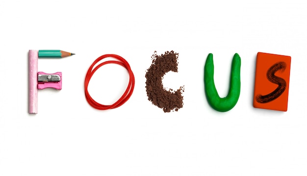 The word focus created from office stationery.