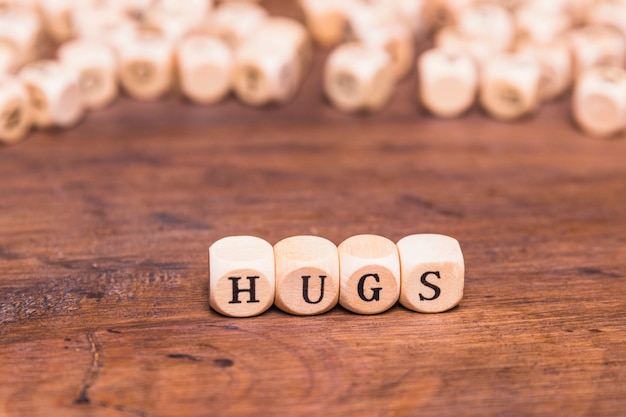 Word hugs written on wooden blocks