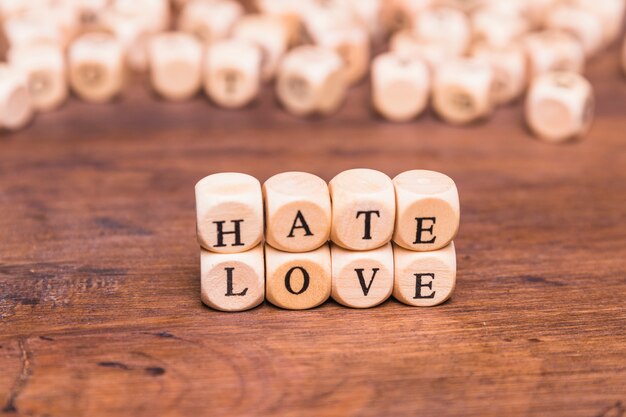 The word love and hate arranged with wooden cubes