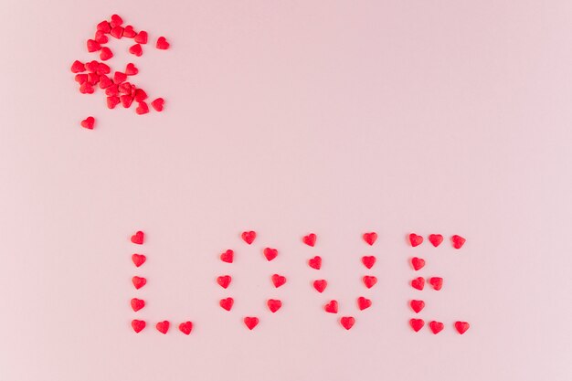 Word love made of decorative hearts