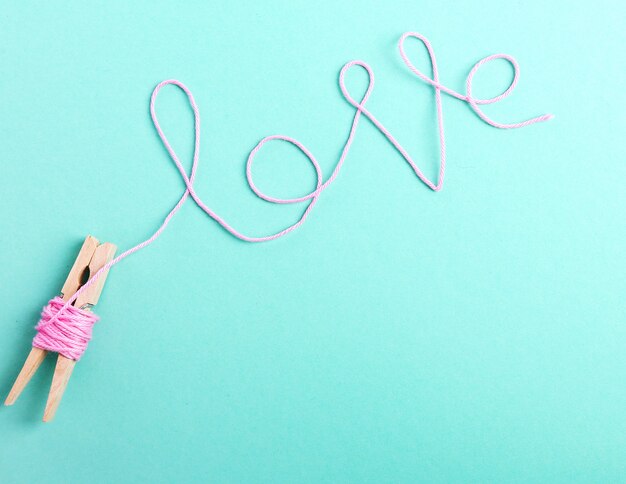 word love made with pink wool roll