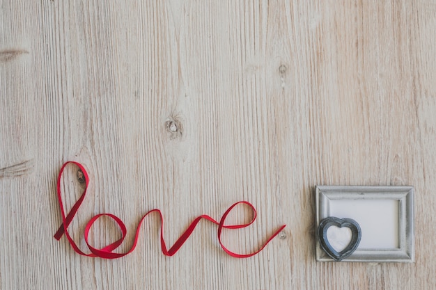 Word "love" with a gray photo frame