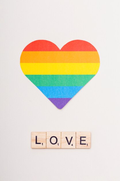 Word love on wooden cubes and lgbt heart