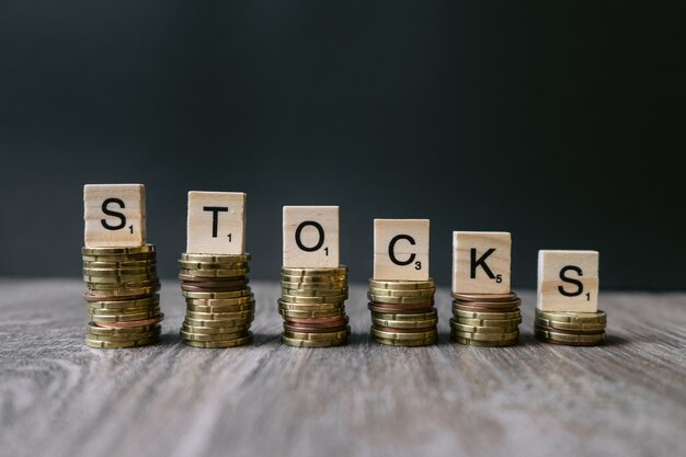 The word "Stocks" on decreasing coins.