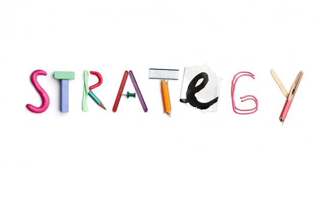 The word strategy created from office stationery.