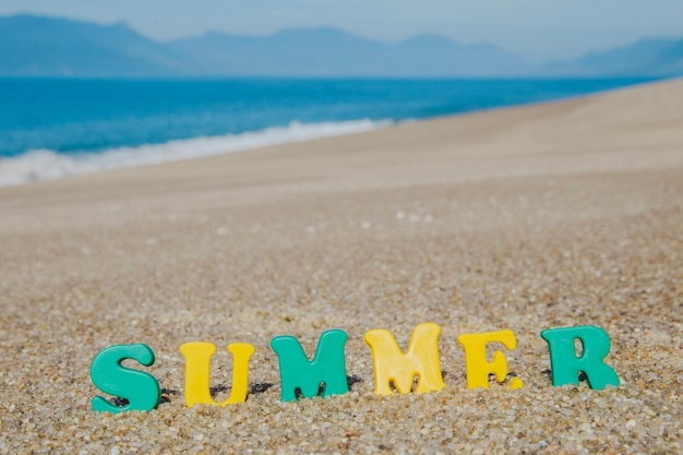 Free photo word 'summer' with colorful letters