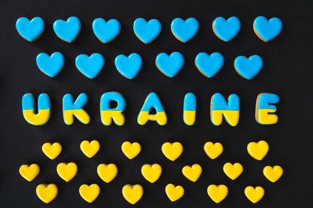 The word Ukraine on a black background made with handmade gingerbread