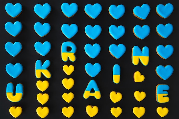 The word Ukraine on a black background made with handmade gingerbread